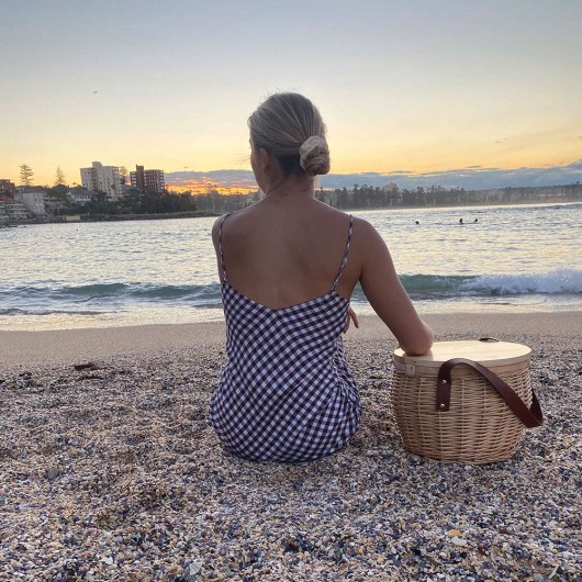 Promotional Wicker Basket Sitting By The Beach